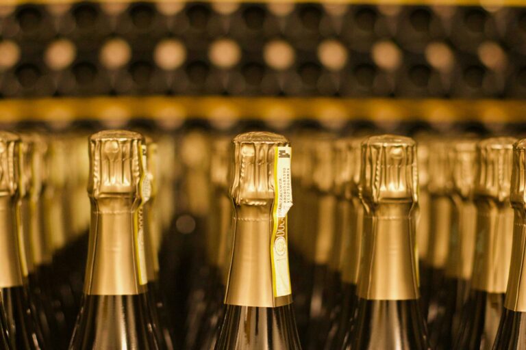 Sparkling wine bottles lined up